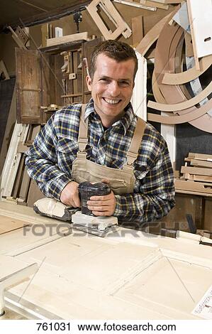 A carpenter using a plane View Large Photo Image Stock Image - A carpenter using a plane. Fotosearch