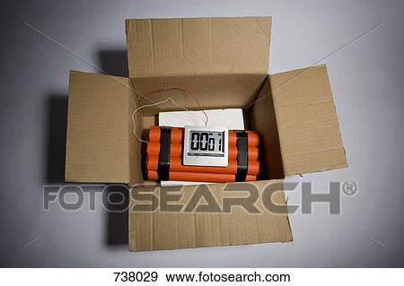 Stock Photo - A dynamite time bomb in a cardboard box with 1 second left on the timer. Fotosearch