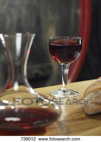 A glass of red wine, a decanter of red wine and a loaf of bread, still life View Large Photo Image Stock Image - A glass of red wine, a decanter of red wine and a loaf of bread, still life. Fotosearch
