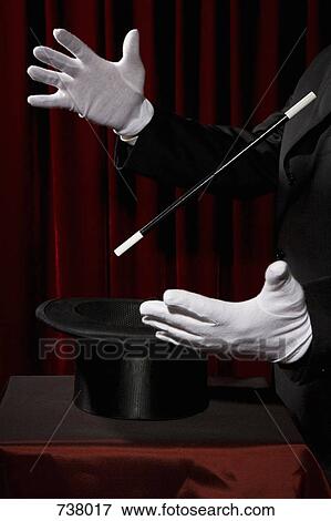 A magician's gloved hands performing a magic trick View Large Photo Image Stock Photo - A magician's gloved hands performing a magic trick. Fotosearch