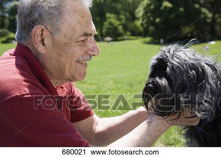 A man and his dog in a park, face to face, Prospect Park, Brooklyn, New York, USA View Large Photo Image Stock Image - A man and his dog in a park, face to face, Prospect Park, Brooklyn, New York, USA. Fotosearch