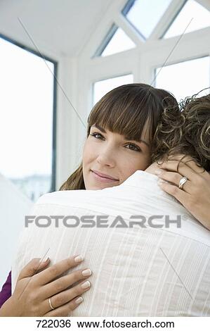 A man and woman embracing View Large Photo Image Stock Photograph - A man and woman embracing. Fotosearch