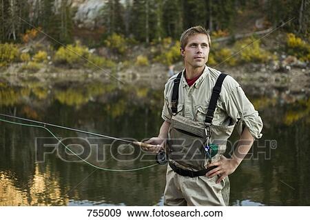 A man fly fishing View Large Photo Image Stock Photo - A man fly fishing. Fotosearch