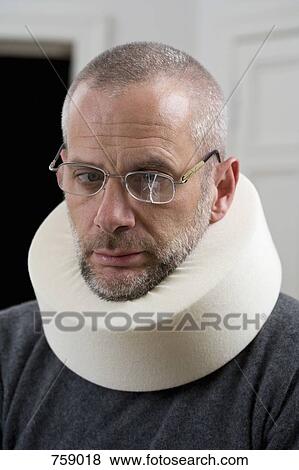 A man wearing a neck brace and cracked glasses View Large Photo Image Stock Photo - A man wearing a neck brace and cracked glasses. Fotosearch
