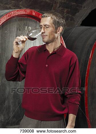 A vintner tasting a red wine View Large Photo Image Stock Photo - A vintner tasting a red wine. Fotosearch