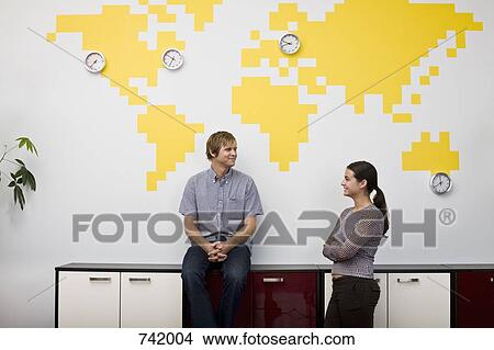 A woman and a man taking a break in an office View Large Photo Image Picture - A woman and a man taking a break in an office. Fotosearch