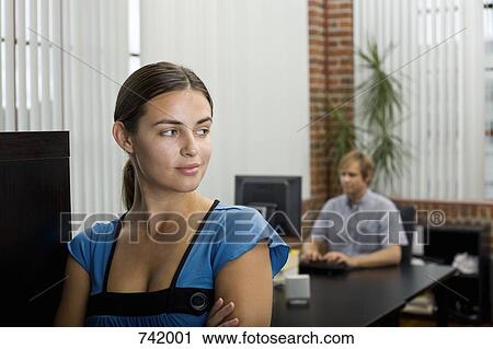 Stock Image - A woman in an office. Fotosearch