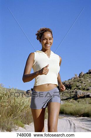 A woman jogging View Large Photo Image Stock Photo - A woman jogging. Fotosearch