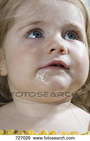 Stock Photograph - A young girl dribbling. Fotosearch
