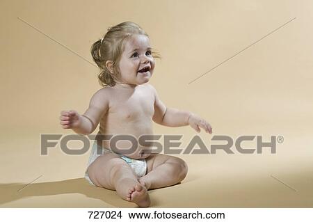 Picture - A young girl wearing a nappy. Fotosearch