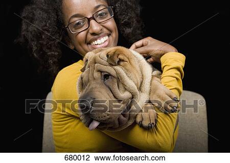 A young woman with her Shar-Pei, studio shot View Large Photo Image Stock Image - A young woman with her Shar-Pei, studio shot. Fotosearch