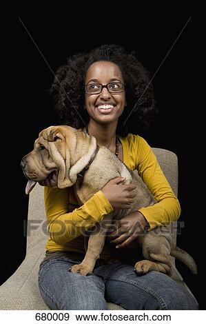 A young woman with her Shar-Pei, studio shot View Large Photo Image Stock Photo - A young woman with her Shar-Pei, studio shot. Fotosearch