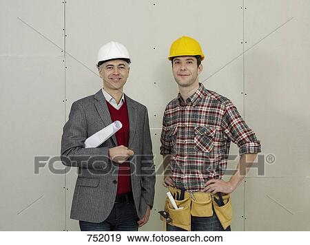 An architect and a construction worker, portrait View Large Photo Image Stock Photo - An architect and a construction worker, portrait. Fotosearch