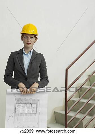 An architect holding a blue print View Large Photo Image Stock Photo - An architect holding a blue print. Fotosearch