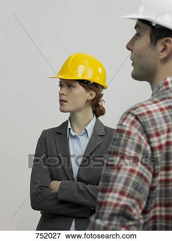 An architect speaking with a construction worker View Large Photo Image Stock Photo - An architect speaking with a construction worker. Fotosearch