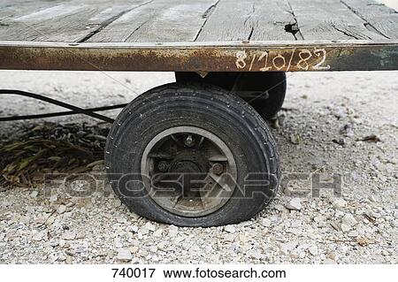 An old fashioned cart with a flat tire, Arles, France View Large Photo Image Stock Photo - An old fashioned cart with a flat tire, Arles, France. Fotosearch