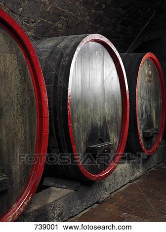 Barrels of wine in a winery cellar View Large Photo Image Stock Image - Barrels of wine in a winery cellar. Fotosearch