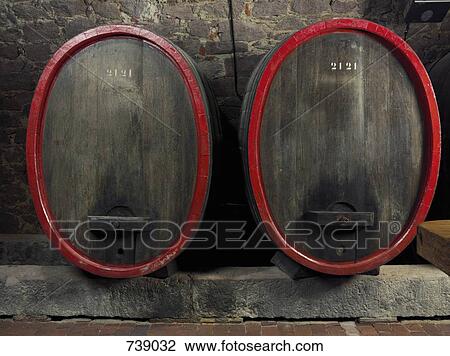 Barrels of wine in a winery cellar View Large Photo Image Stock Image - Barrels of wine in a winery cellar. Fotosearch