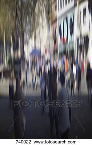 Defocused street scene with people walking View Large Photo Image Stock Image - Defocused street scene with people walking. Fotosearch