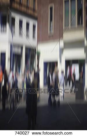 Defocused street scene with people walking View Large Photo Image Stock Photo - Defocused street scene with people walking. Fotosearch