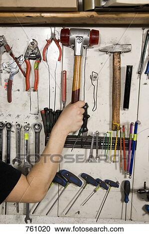 Detail of a man reaching for a hammer View Large Photo Image Stock Image - Detail of a man reaching for a hammer. Fotosearch