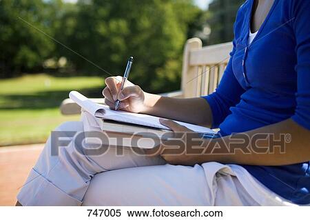 Detail of a young woman writing View Large Photo Image Stock Photography - Detail of a young woman writing. Fotosearch