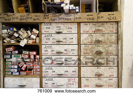 Stock Photo - Drawers and shelves in a workshop. Fotosearch