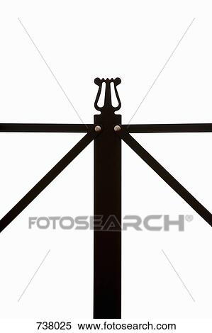 Stock Photography - Extreme close-up of the lyre symbol on a musical stand. Fotosearch