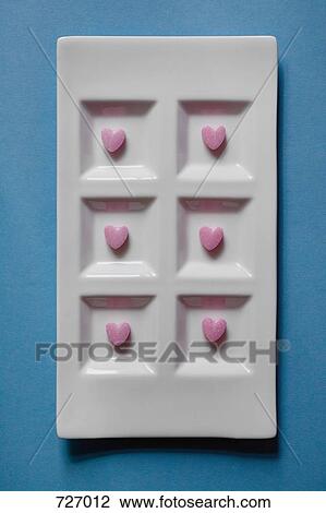 Heart-shaped sweets in a dish View Large Photo Image Stock Image - Heart-shaped sweets in a dish. Fotosearch