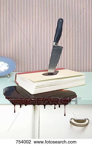 Knife stabbing a book on a dresser View Large Photo Image Stock Image - Knife stabbing a book on a dresser. Fotosearch