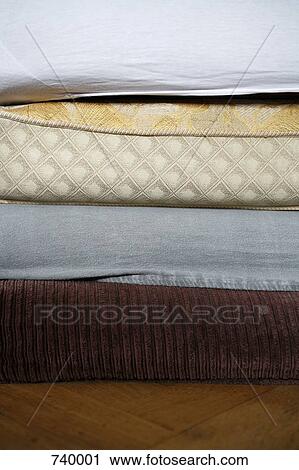 Mattresses stacked on top of each other View Large Photo Image Stock Image - Mattresses stacked on top of each other. Fotosearch
