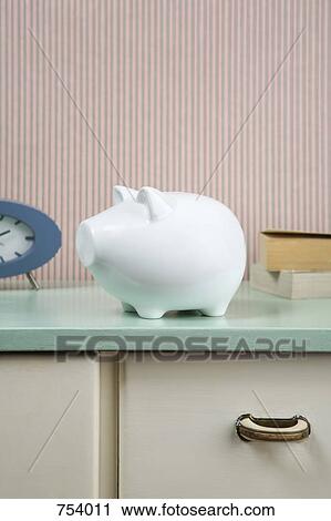 Piggy bank on a dresser View Large Photo Image Stock Image - Piggy bank on a dresser. Fotosearch