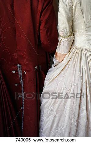 Rear view of two people wearing period costume View Large Photo Image Stock Photography - Rear view of two people wearing period costume. Fotosearch
