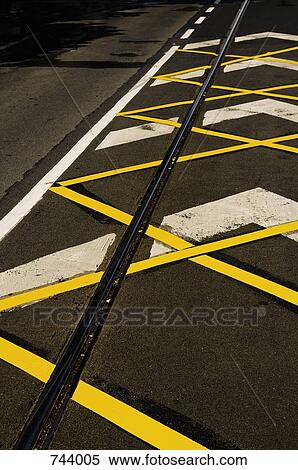 Road markings and a tramline along a road View Large Photo Image Stock Photography - Road markings and a tramline along a road. Fotosearch