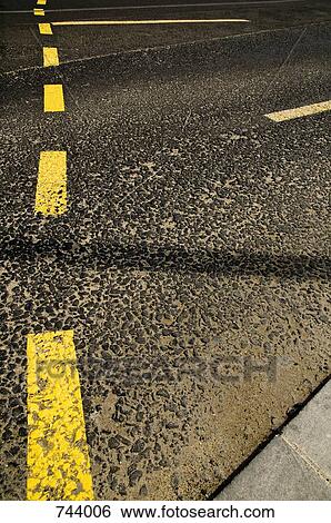 Stock Photograph - Roads markings on an asphalt road. Fotosearch