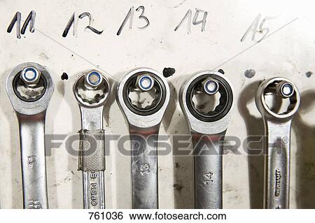 Stock Photograph - Socket wrenches hanging on a wall. Fotosearch