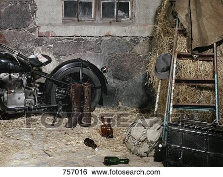 Still life of a parked vintage motorcycle, riding boots, suitcase and beer bottles View Large Photo Image Stock Photograph - Still life of a parked vintage motorcycle, riding boots, suitcase and beer bottles. Fotosearch