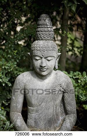 Stone statue of a Buddha View Large Photo Image Stock Photograph - Stone statue of a Buddha. Fotosearch