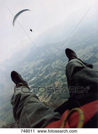 View of a man parasailing View Large Photo Image Stock Image - View of a man parasailing. Fotosearch