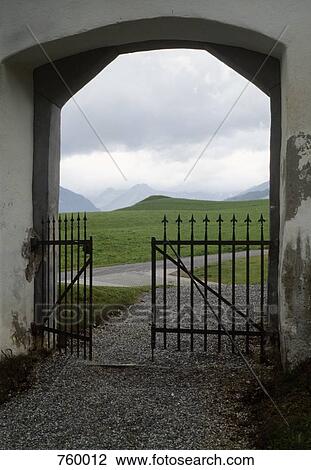 View through a gate of mountain ranges View Large Photo Image Stock Image - View through a gate of mountain ranges. Fotosearch