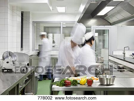 A busy commercial kitchen View Large Photo Image Stock Image - A busy commercial kitchen. Fotosearch