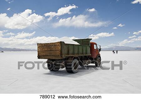 Stock Image - A dump truck on a salt flat, Salinas Grandes, Argentina. Fotosearch