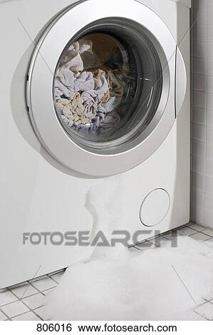 Stock Photograph - A leaking washing machine. Fotosearch