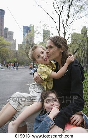 A mother sitting with her children in Central Park, New York City View Large Photo Image Stock Image - A mother sitting with her children in Central Park, New York City. Fotosearch