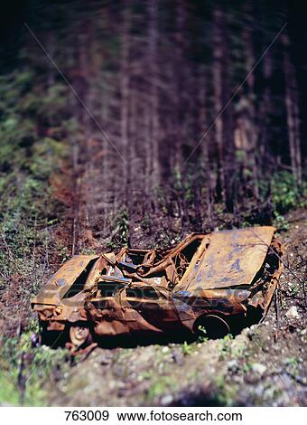 A rusted car wreck, tilt-shift photography View Large Photo Image Stock Photo - A rusted car wreck, tilt-shift photography. Fotosearch