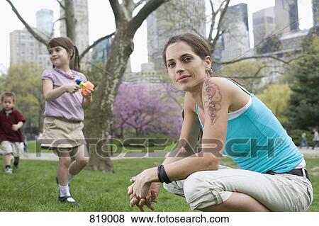 A woman and her children in Central Park, New York City View Large Photo Image Stock Photo - A woman and her children in Central Park, New York City. Fotosearch