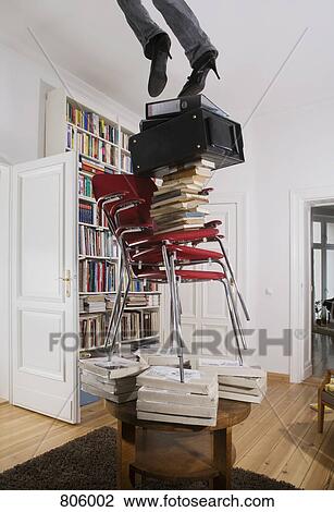 A woman falling off a stack of objects, low section View Large Photo Image Stock Image - A woman falling off a stack of objects, low section. Fotosearch