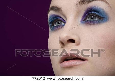 Stock Image - A woman with dramatic eye make up. Fotosearch