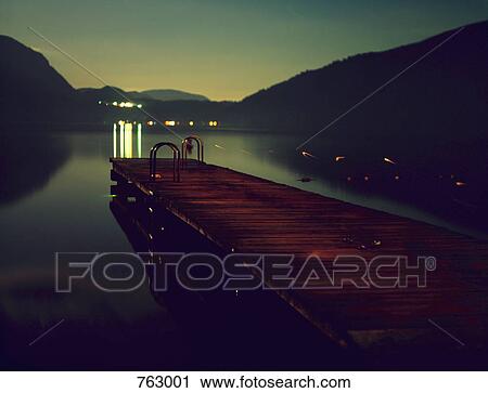 A wooden jetty at dusk View Large Photo Image Stock Image - A wooden jetty at dusk. Fotosearch