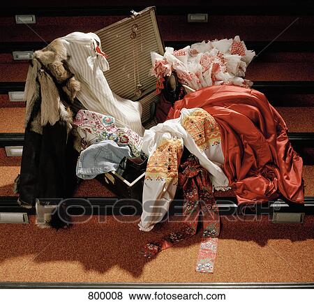 Costumes spilling out of a suitcase View Large Photo Image Stock Photo - Costumes spilling out of a suitcase. Fotosearch